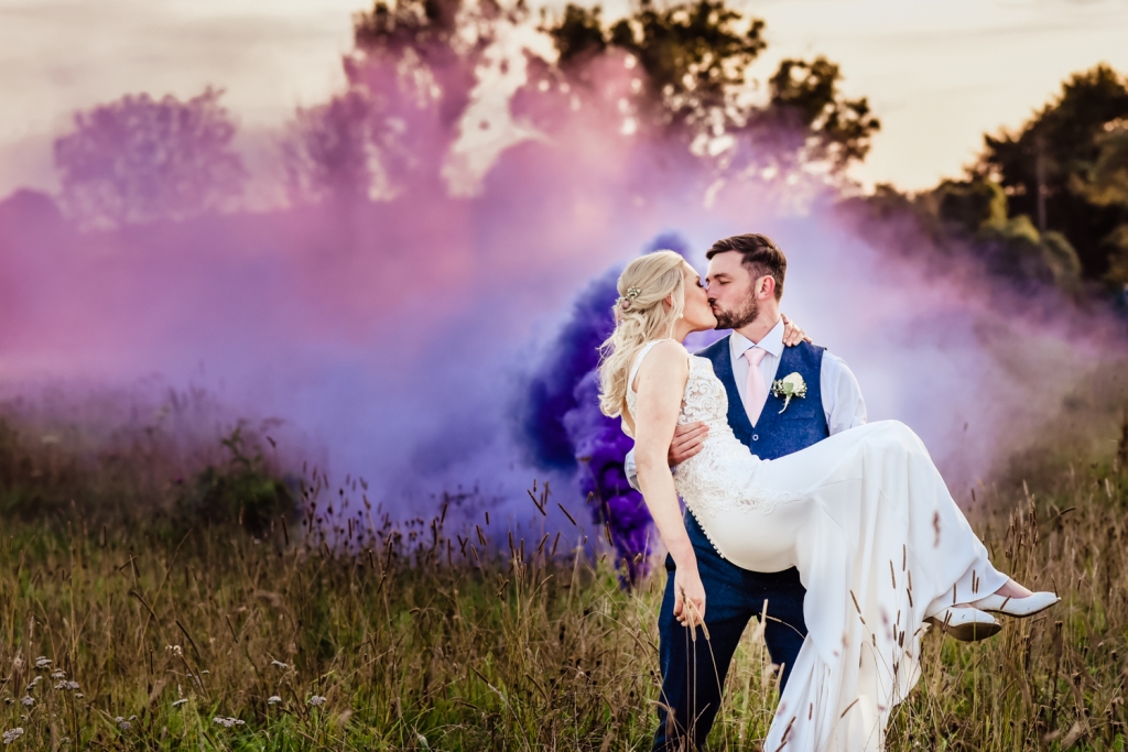 bride and groom kissing colourful striking wedding photography