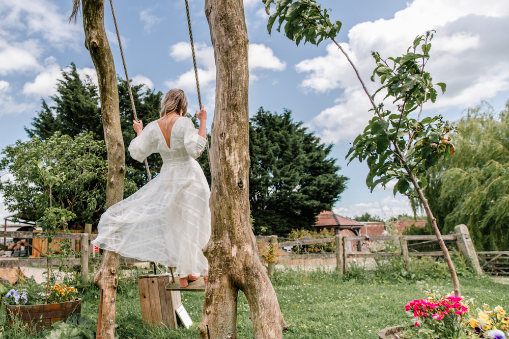 bride on swing wedding milton end farm