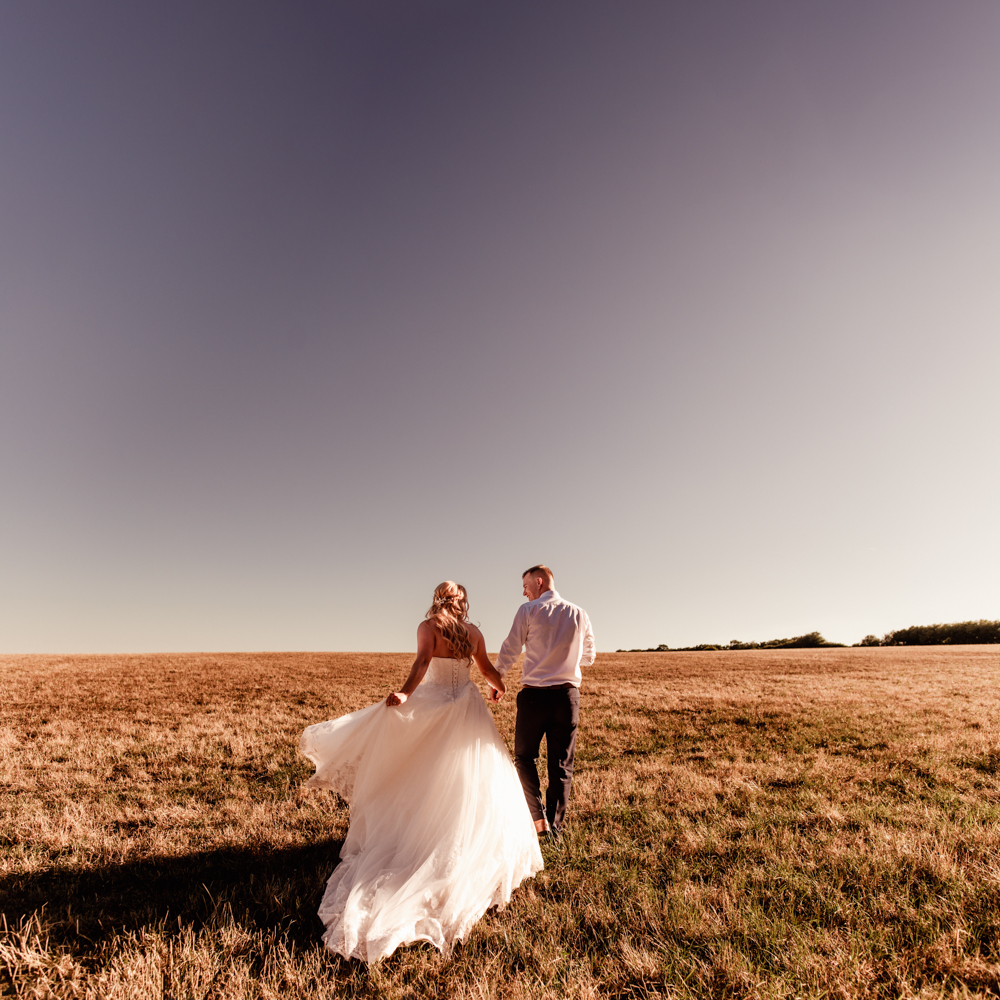 bride and groom walking countryside romantic 