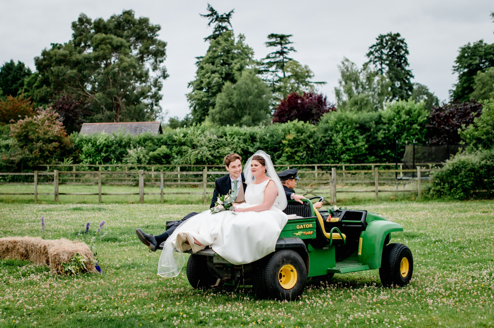 bride and groom gator wedding transport
